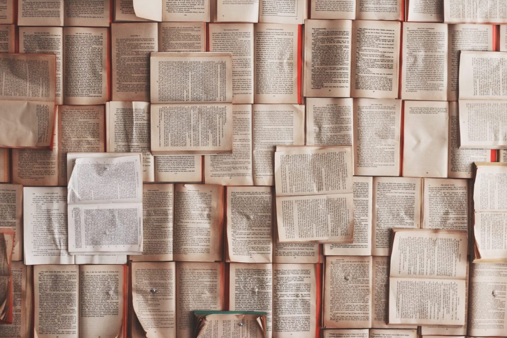 Open books spread across a table.