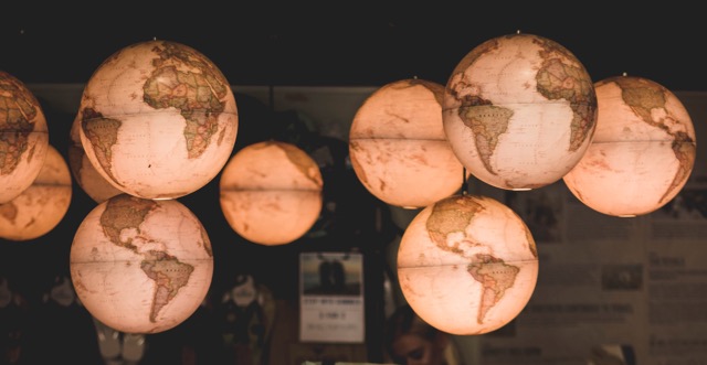 Lighted globes hanging from ceiling