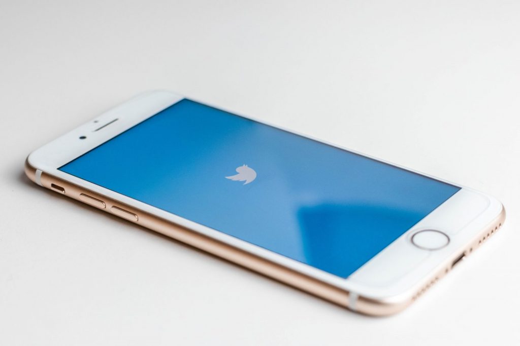 Mobile phone with twitter loading