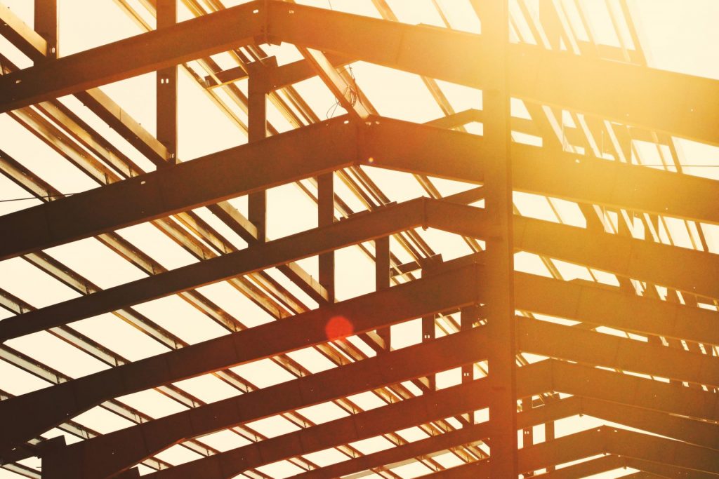Black steel frame roof with sunlight shining through