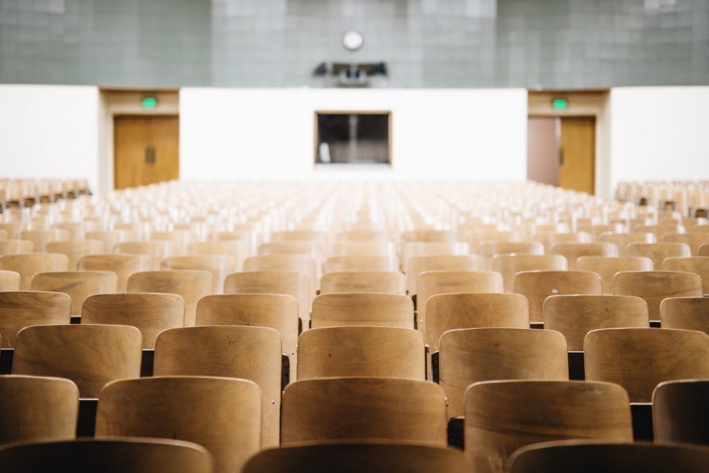 Empty chairs in lecture theatre.